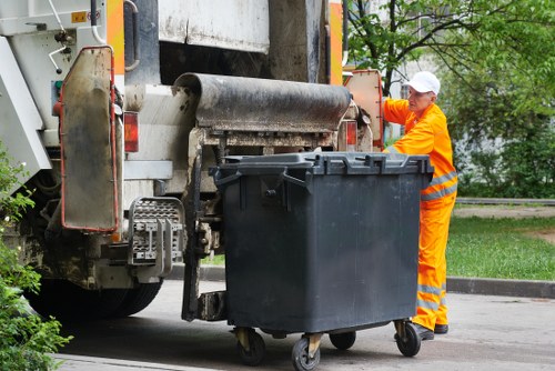 Recycling bins and clear signage for a sustainable rubbish area in Teddington